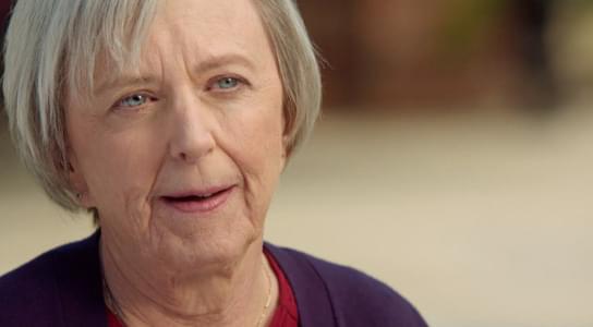 Barbara, speaking to the camera while outside.